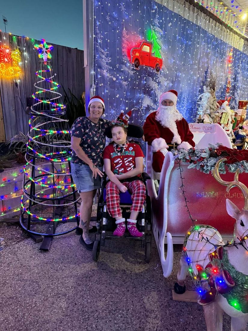 Shontae and her Lionheart support worker out at night among Christmas light displays